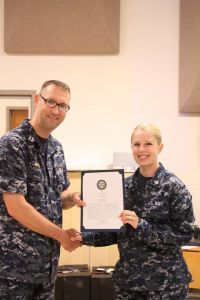 Accepting my Bluejacket of the Quarter commendation letter